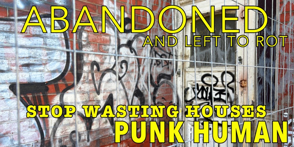 Graffiti on a wall of an abandoned building with a door behind a fence, featuring bold text urging action against house abandonment.