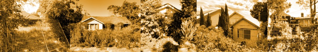 A sepia-toned panoramic view of several houses surrounded by lush greenery and a fence.