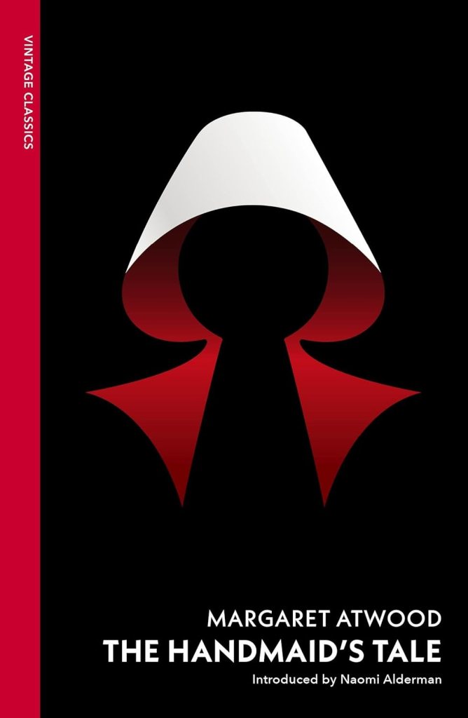 Cover of 'The Handmaid's Tale' by Margaret Atwood, featuring a minimalist design with a stylised red and white bonnet against a black background.