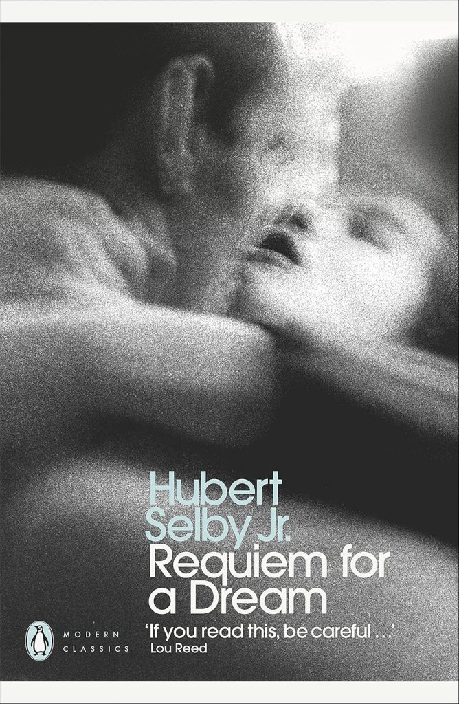 Cover of 'Requiem for a Dream' by Hubert Selby Jr., featuring a blurred image of two faces close together, with text in light blue and black.