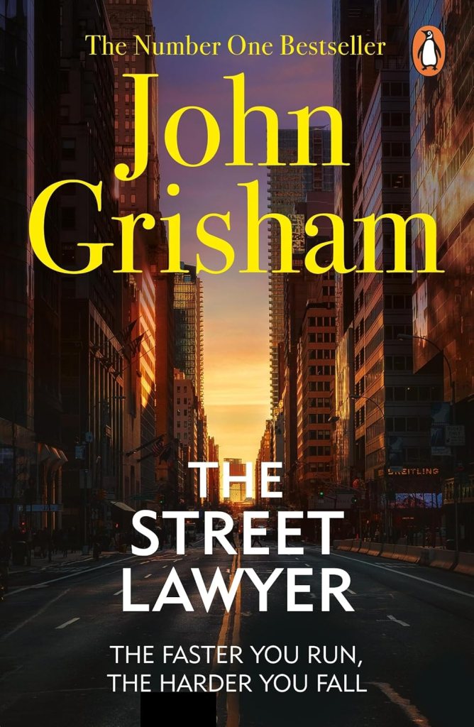 Cover of 'The Street Lawyer' by John Grisham featuring a city street at sunset with skyscrapers and the tagline 'The faster you run, the harder you fall'.