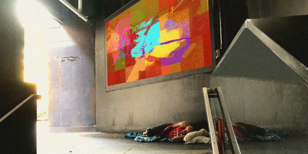 A person sleeping on the floor next to a brightly coloured abstract wall mural in a sheltered urban area.