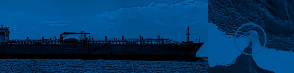 A large cargo ship silhouetted against a blue background, with a focus on its structure and surrounding waves.